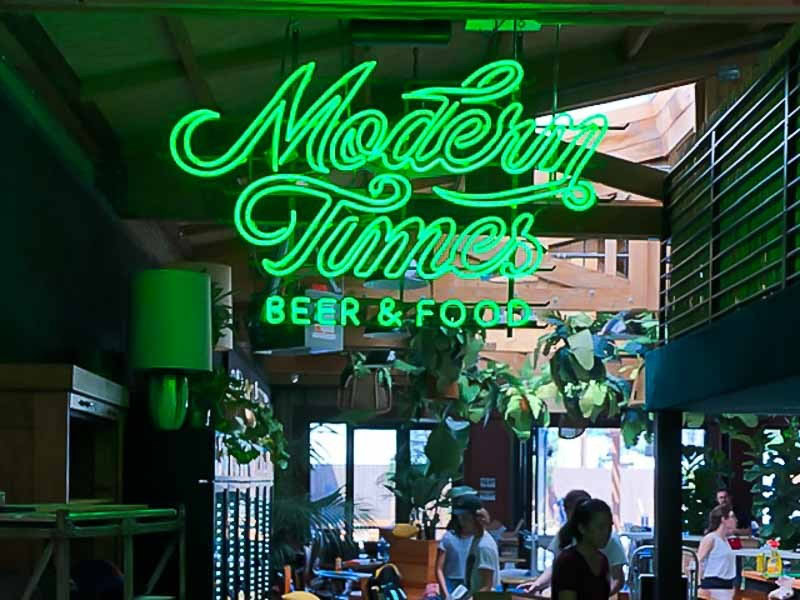 Modern Times Beer & Food custom neon window sign in Santa Barbara, California. Custom neon signs Santa Barbara by Dave's Signs.
