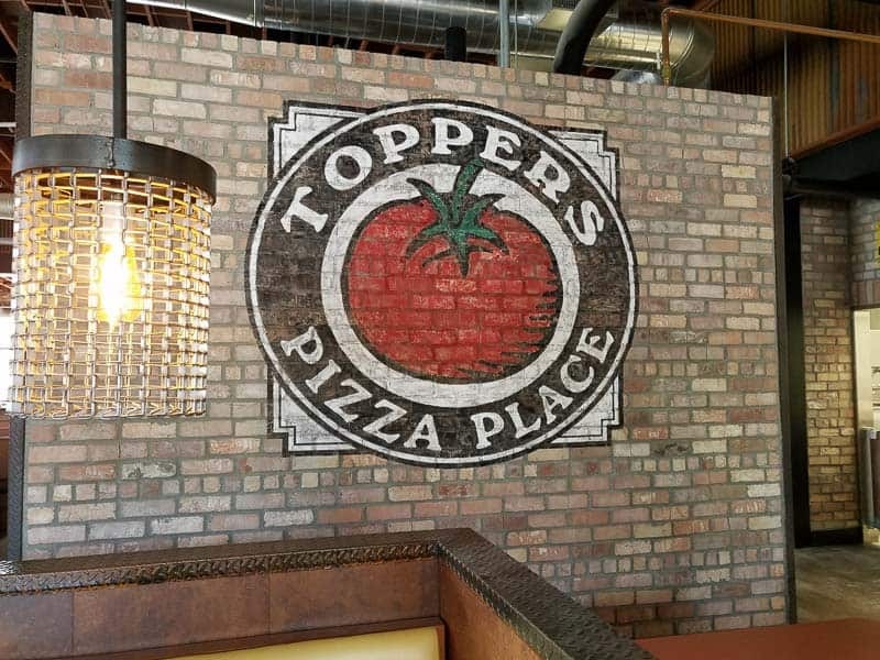 Indoor hand-painted restaurant signs for Toppers Pizza Place in Canyon Country, California.