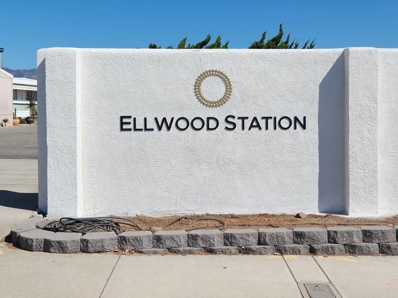 This is a dimensional letter sign on the wall entering Ellwood Station, a residential community in Goleta.