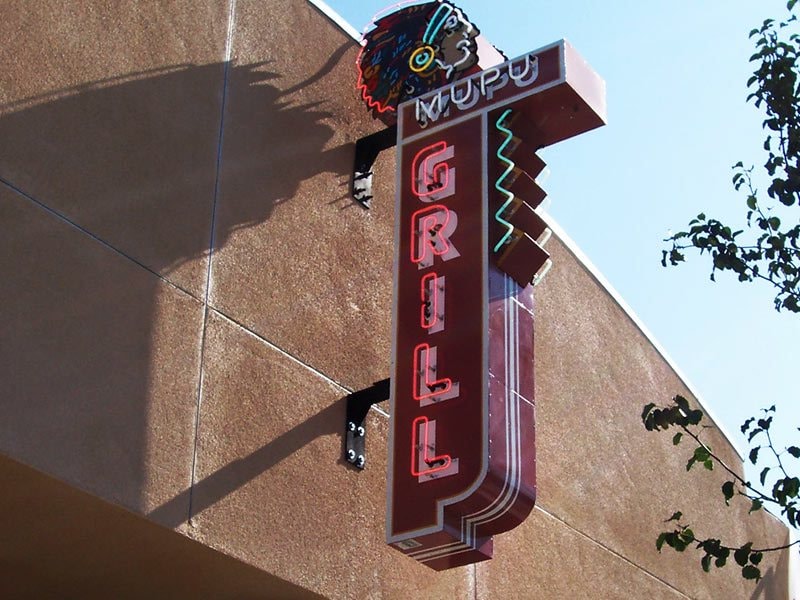 Types of signs: Illuminated blade sign with neon lights for Mupu Grill in Santa Paula, California.
