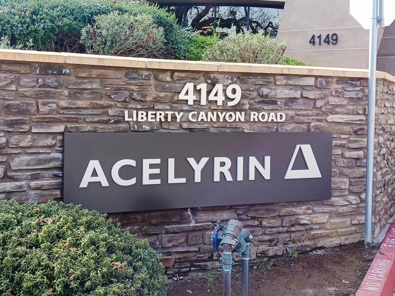 Acelyrin channel letter sign mounted on the wall at the business park.