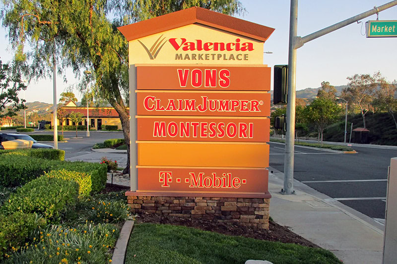 This architectural sign for Valencia Marketplace Shopping Center complements the center's aesthetics.