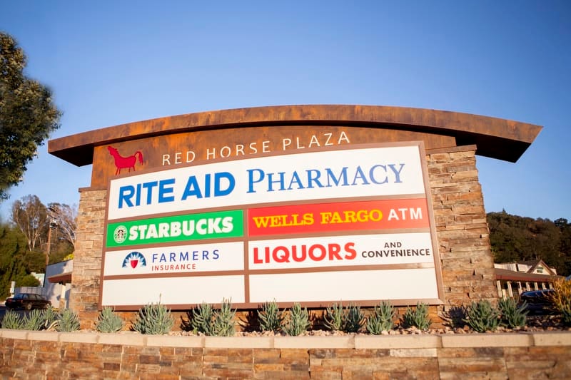 The Red Horse Plaza monument sign in Ojai, California, is a nice example of using natural elements to enhance the space and business visibility.